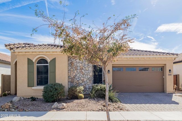 mediterranean / spanish-style home featuring a garage