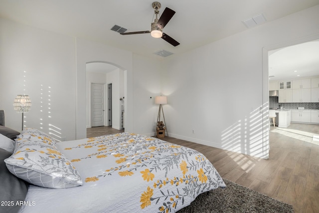 bedroom featuring ceiling fan and light hardwood / wood-style floors