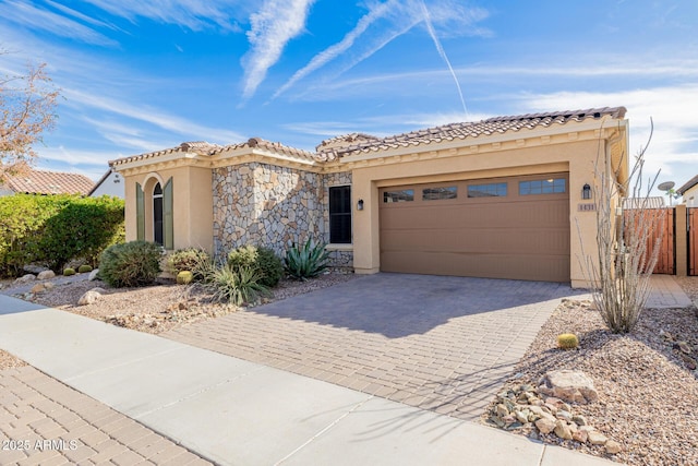 mediterranean / spanish-style house featuring a garage