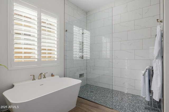 bathroom with hardwood / wood-style flooring and plus walk in shower