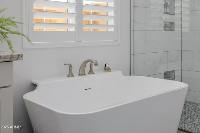 bathroom featuring sink and a bathing tub