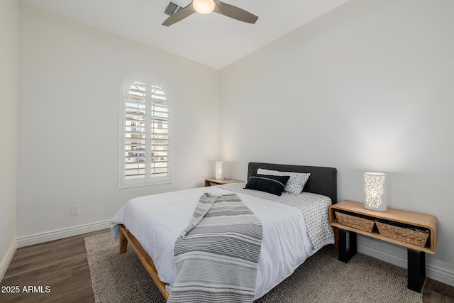 bedroom with ceiling fan and dark hardwood / wood-style flooring