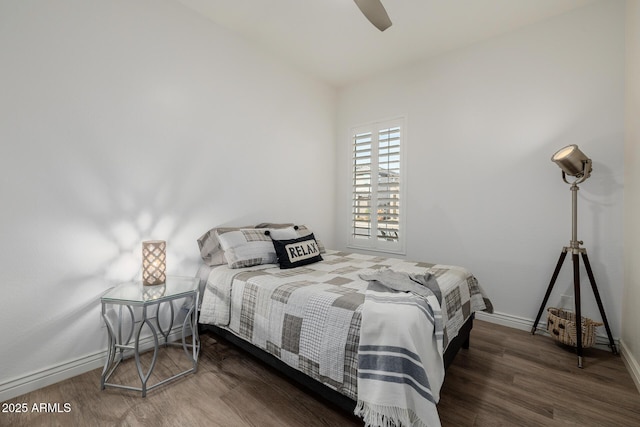 bedroom featuring ceiling fan and dark hardwood / wood-style flooring