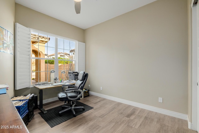 office with ceiling fan and light wood-type flooring