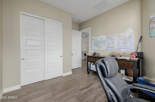 office space with light hardwood / wood-style flooring