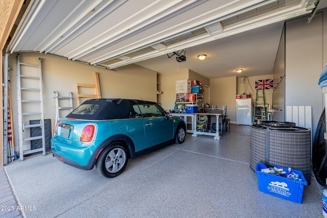 garage with a garage door opener and refrigerator