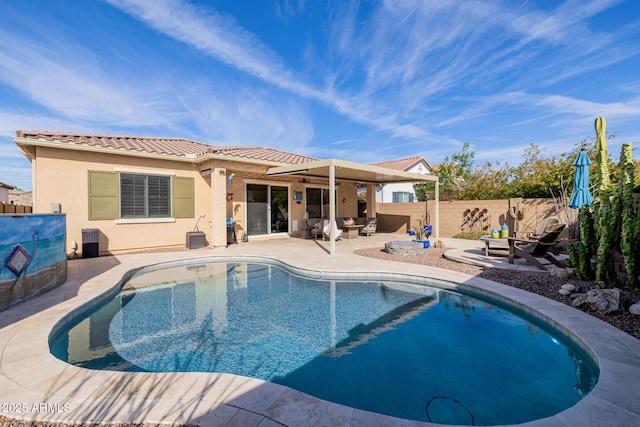 view of pool featuring central AC unit, a patio, and an outdoor fire pit