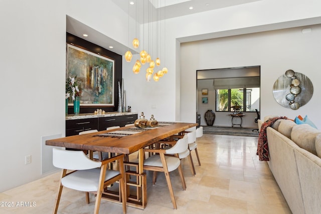 dining room featuring a high ceiling