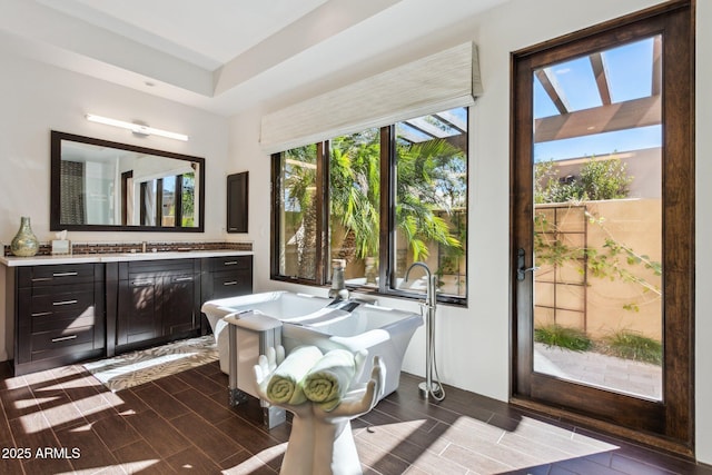 bathroom featuring vanity and a bathtub