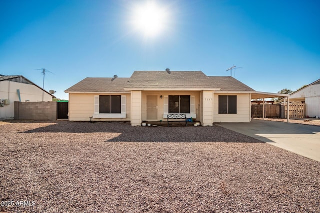 rear view of house featuring a carport