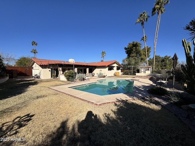 view of pool featuring an outbuilding and a patio