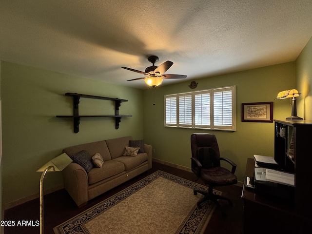 office with ceiling fan and a textured ceiling