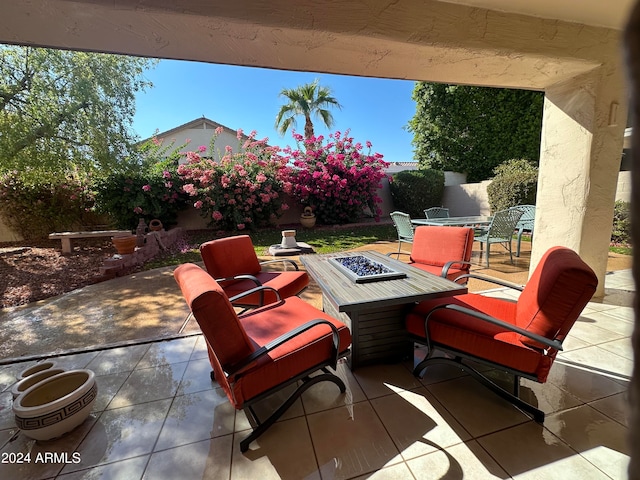 view of patio with a fire pit