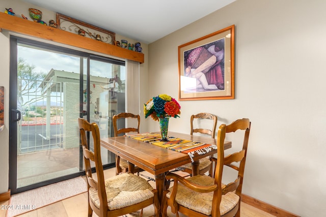 dining room featuring a wealth of natural light and light wood-type flooring