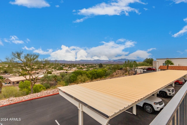 view of patio featuring a mountain view and a carport