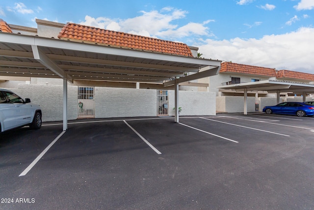 view of car parking featuring a carport