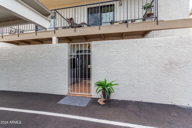 property entrance with a balcony