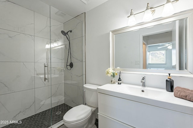 bathroom with a marble finish shower, toilet, and vanity