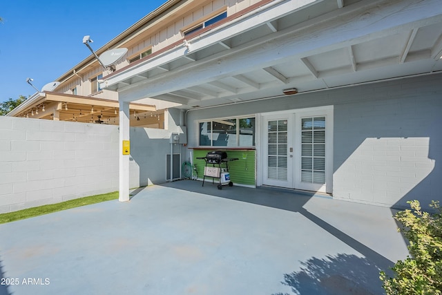 view of patio / terrace with french doors and fence