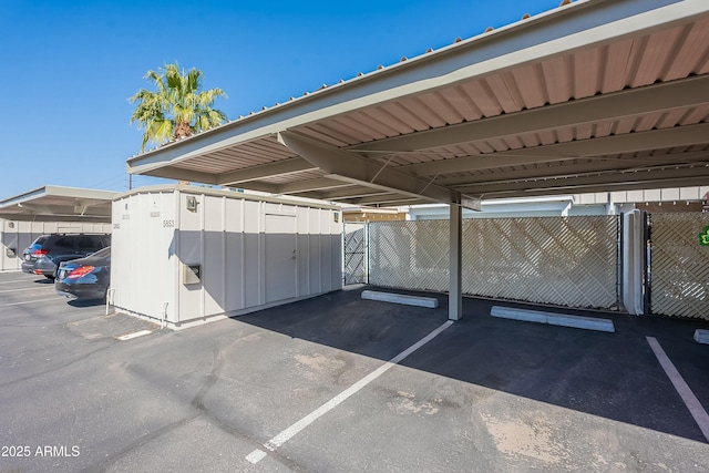 covered parking lot with fence