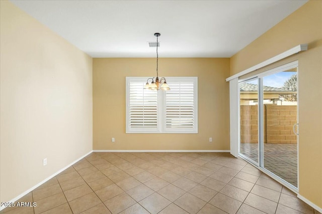 empty room featuring an inviting chandelier, visible vents, light tile patterned floors, and baseboards