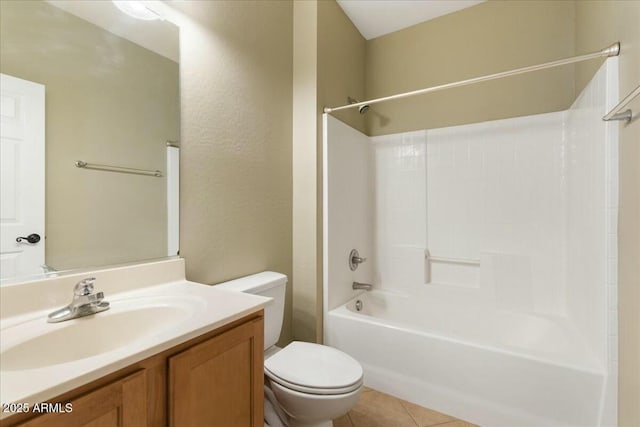 bathroom featuring  shower combination, vanity, toilet, and tile patterned floors