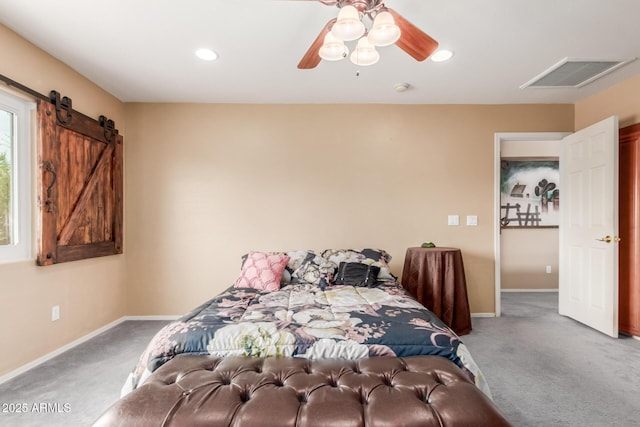 22022 W Moonlight Path, Buckeye, AZ 85326 - bedroom with carpet, baseboards, a barn door, recessed lighting, and a ceiling fan
