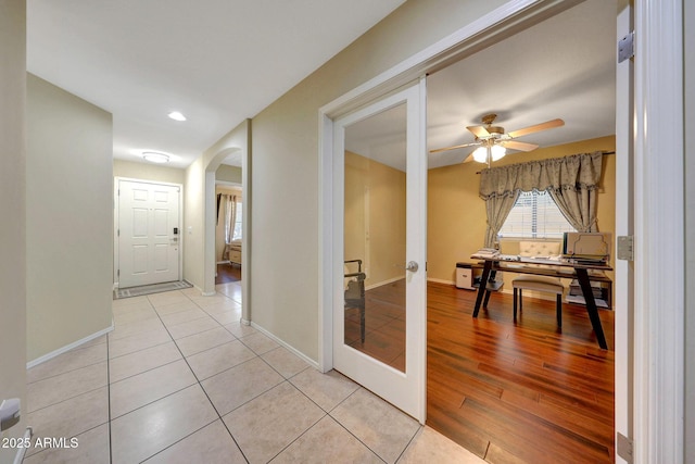 9926 W Gross Ave, Tolleson, AZ 85353 - hallway featuring arched walkways, light wood-type flooring, and recessed lighting