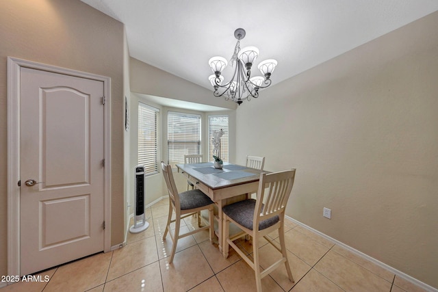 9926 W Gross Ave, Tolleson, AZ 85353 - dining area featuring lofted ceiling, a chandelier, and light tile patterned flooring
