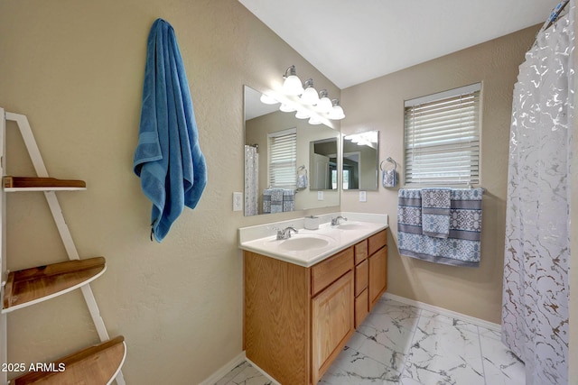 9926 W Gross Ave, Tolleson, AZ 85353 - full bathroom featuring double vanity and marble look tile flooring