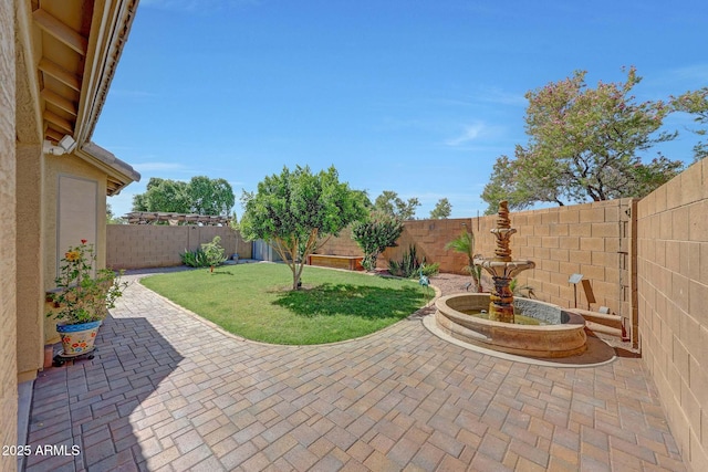 9926 W Gross Ave, Tolleson, AZ 85353 - fenced backyard with a patio area
