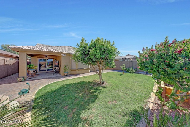 9926 W Gross Ave, Tolleson, AZ 85353 - fenced backyard with a ceiling fan and a patio area