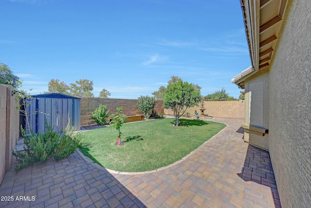 9926 W Gross Ave, Tolleson, AZ 85353 - fenced backyard featuring a patio area and a storage shed