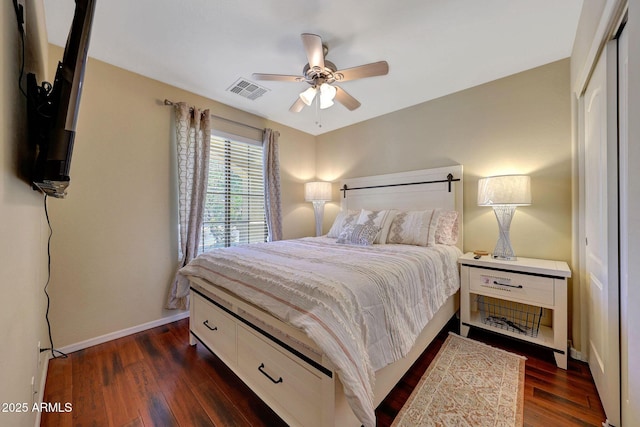 9926 W Gross Ave, Tolleson, AZ 85353 - bedroom with dark wood-style flooring, a closet, and a ceiling fan
