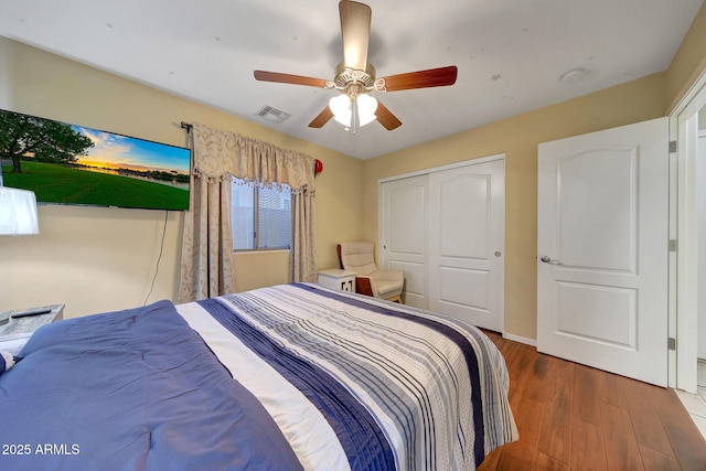 9926 W Gross Ave, Tolleson, AZ 85353 - bedroom with wood finished floors, a closet, and ceiling fan