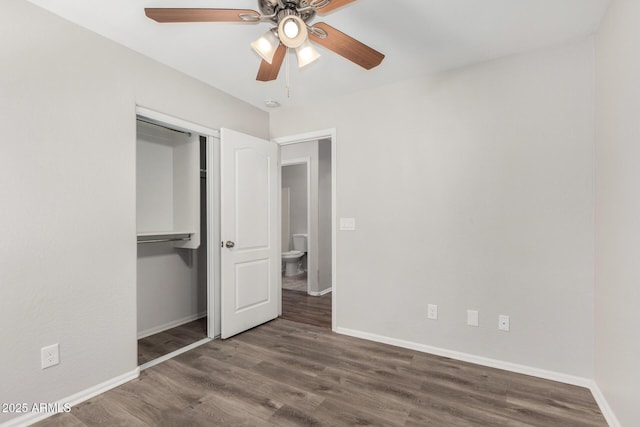unfurnished bedroom featuring baseboards, wood finished floors, a closet, and ceiling fan