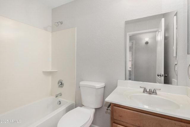 bathroom featuring bathtub / shower combination, vanity, and toilet