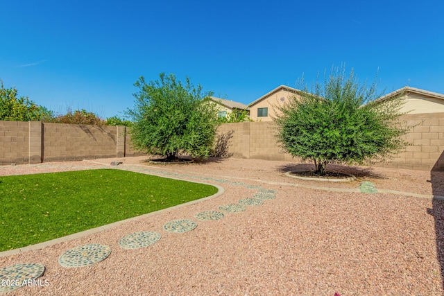 view of yard featuring a fenced backyard