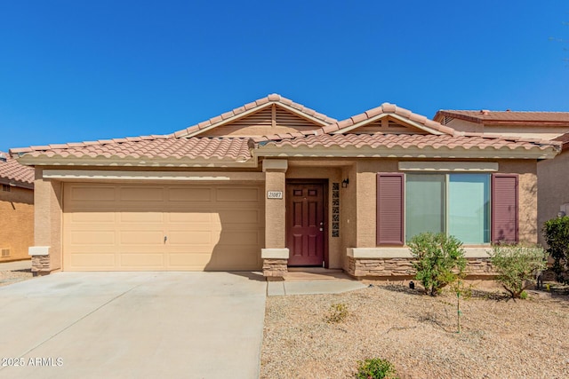 ranch-style home featuring stucco siding, a tile roof, driveway, stone siding, and a garage