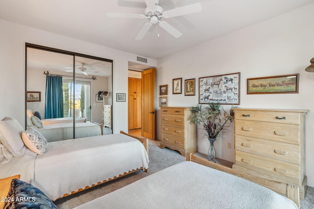 bedroom featuring carpet flooring, ceiling fan, and a closet