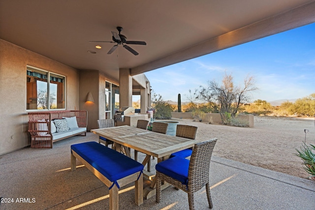 view of patio / terrace with ceiling fan and area for grilling