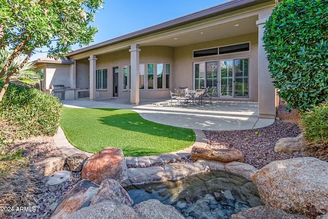 back of house with a patio area