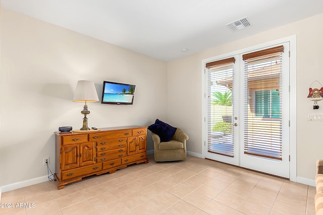 sitting room with light tile patterned flooring