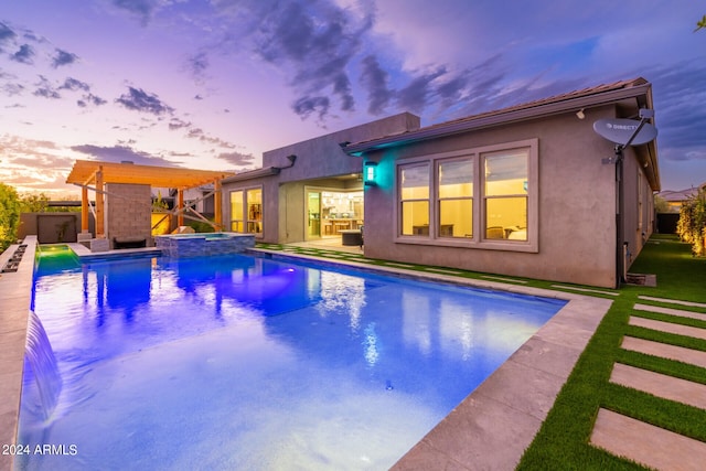 pool at dusk featuring a patio area and a lawn