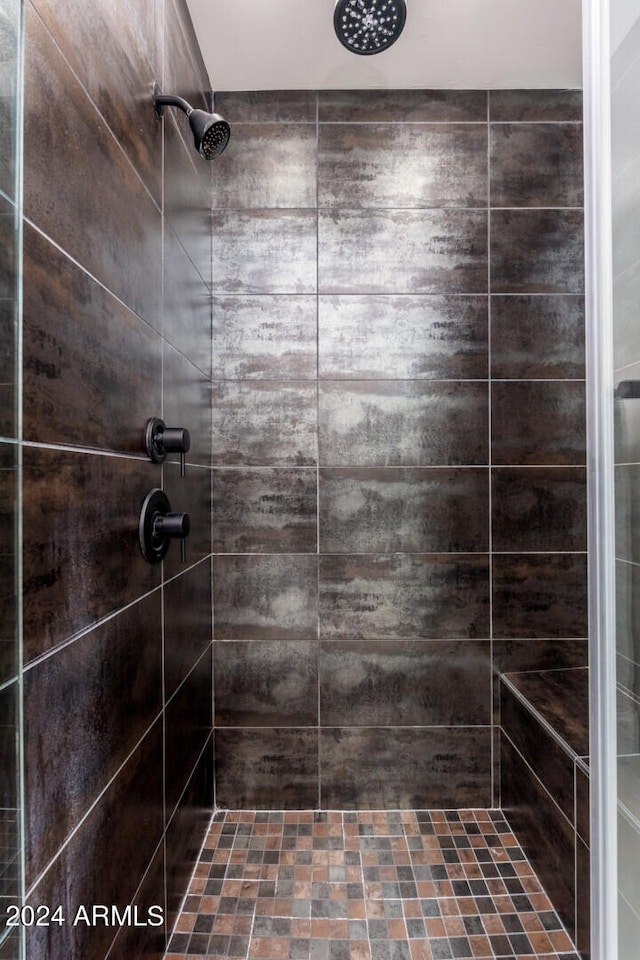 bathroom with tiled shower