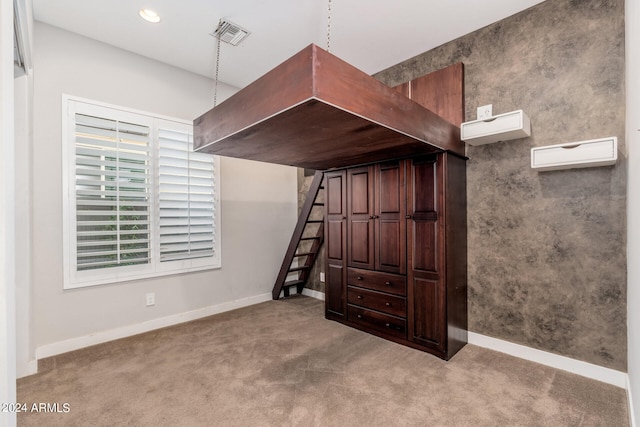 interior space featuring light carpet