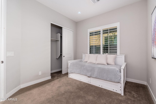 carpeted bedroom featuring a closet