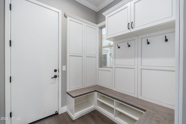 mudroom featuring dark hardwood / wood-style flooring and crown molding