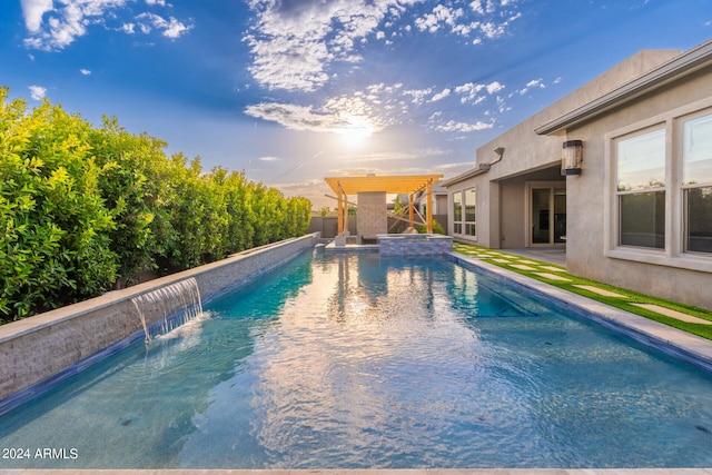 view of swimming pool with a patio and pool water feature