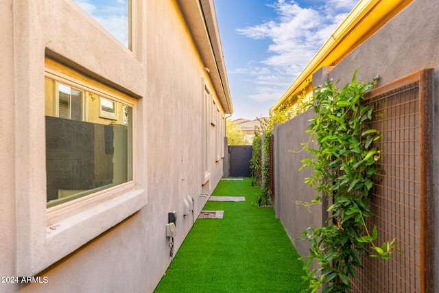 view of home's exterior with a lawn